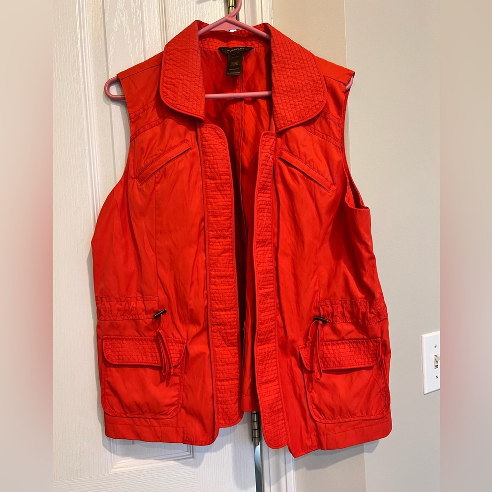 Orange vest, lightweight.  Size unknown. Most likely LG.  Great condition.